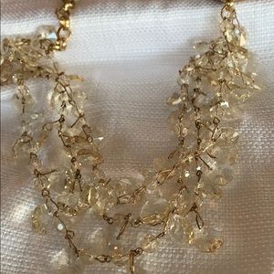 Triple strand gold and faux crystal neckless